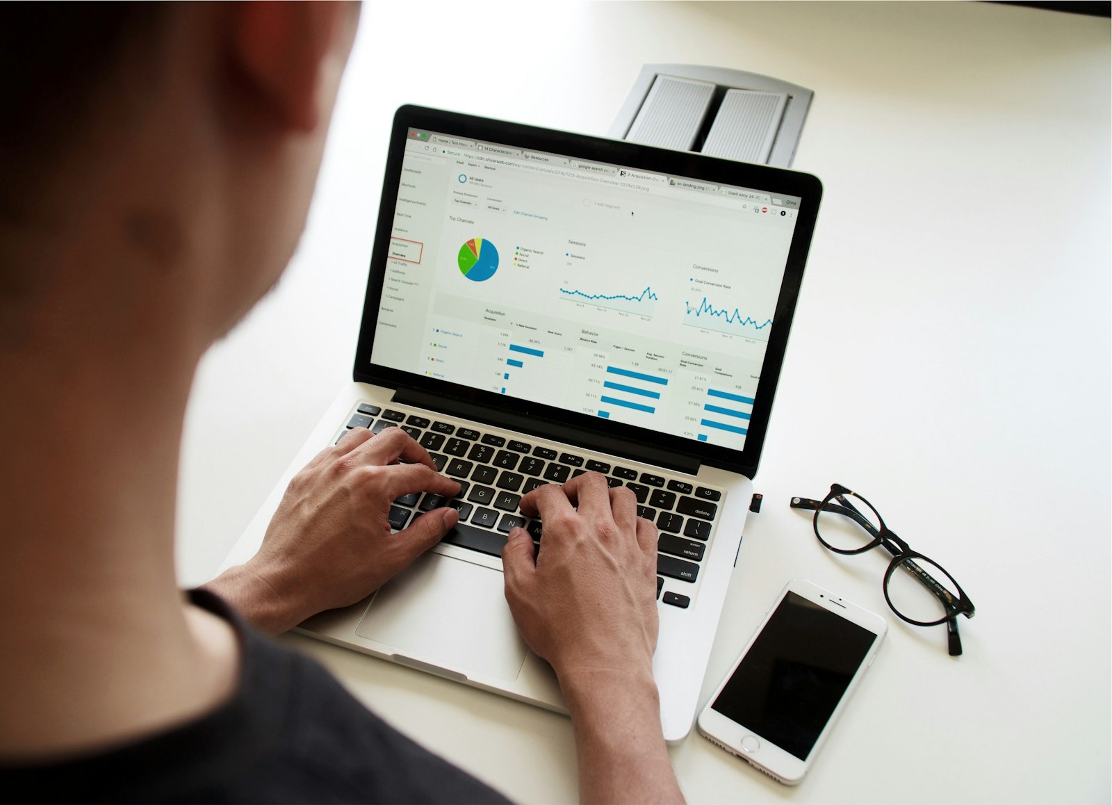 Team reviewing marketing analytics on a laptop